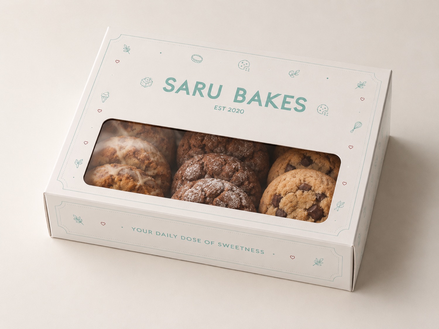 Saru Bakes window box of cookies framed by the bakery-icon pattern border